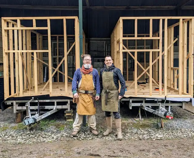 Cosy off-grid cabin interior with log burner and handcrafted wooden details