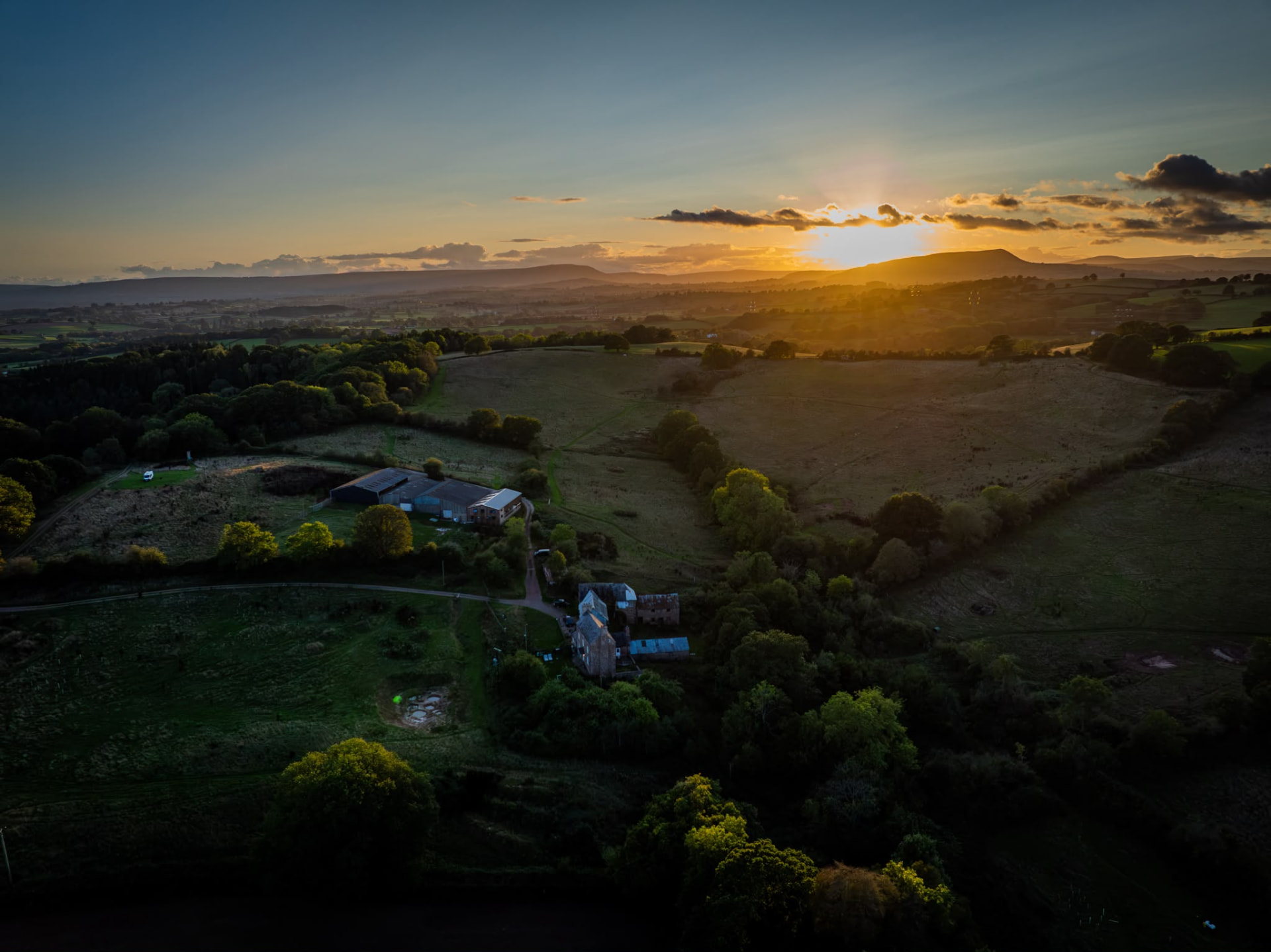 Aerial view of the Grange Project at sunset, looking towards the hills
